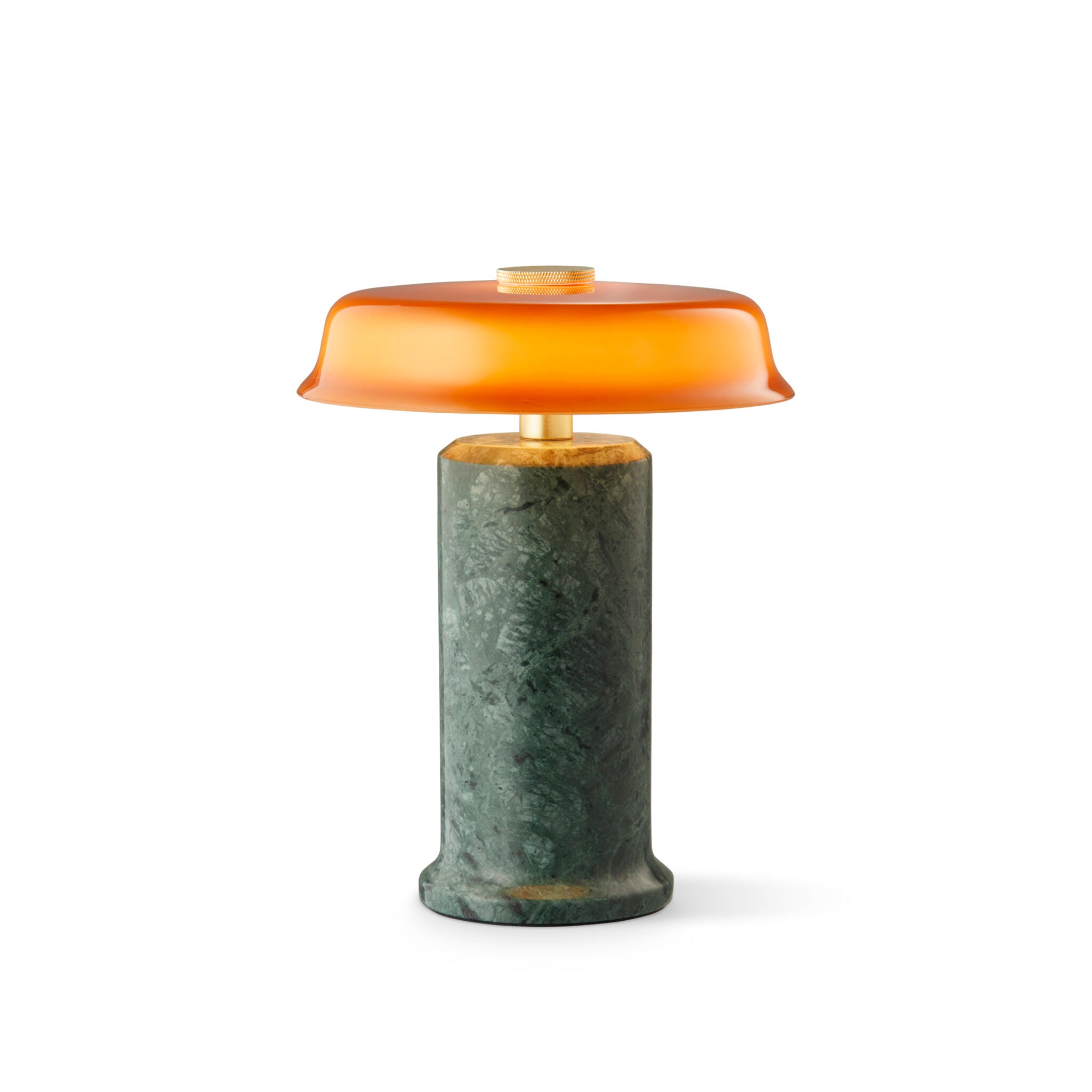 Lampe artisanale en marbre brut, dotée d’un verre soufflé à la bouche pour une lumière douce et élégante.